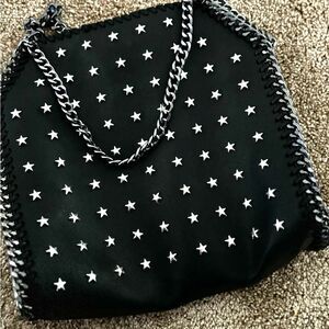Black cross body bag with chain and silver stars